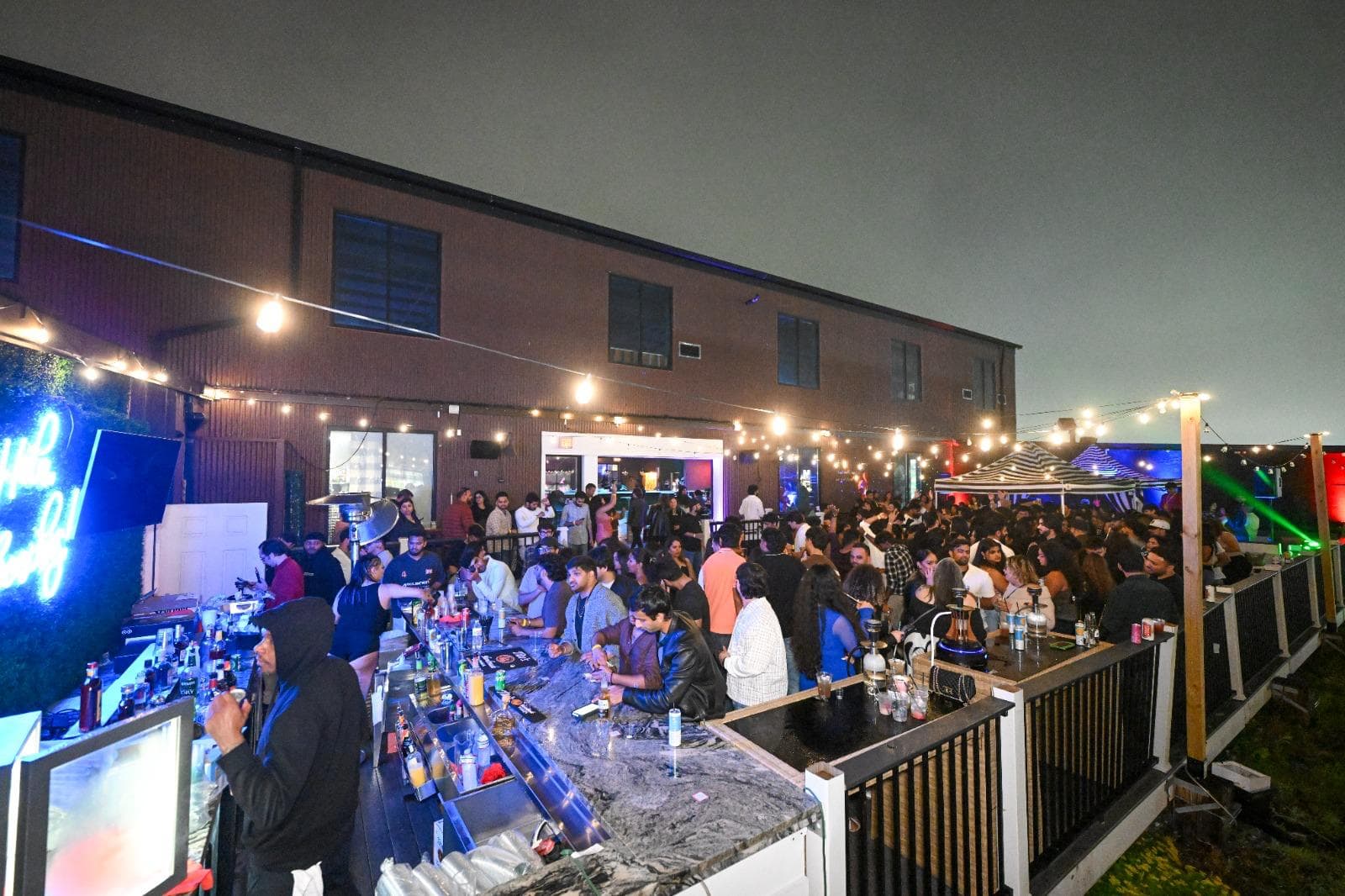 A busy night at the rooftop bar