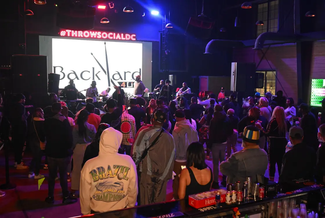 A full room facing the stage under the THRōW LED wall