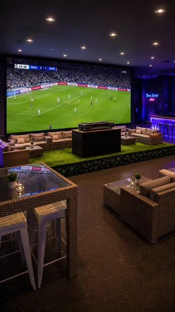 A football match on the big screen over lounge seating