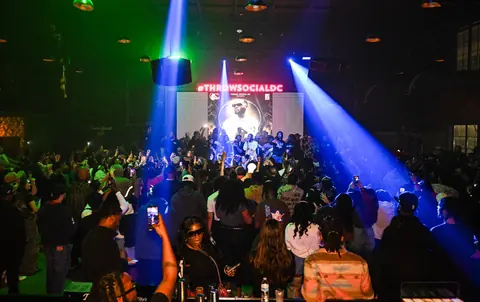 The crowd under blue and green lasers