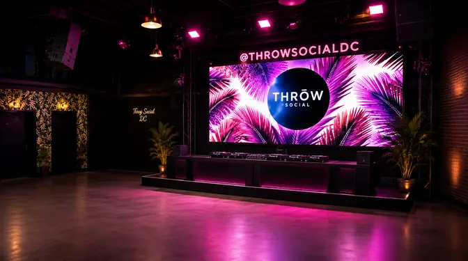 The dance floor under the THRōW LED wall in pink light