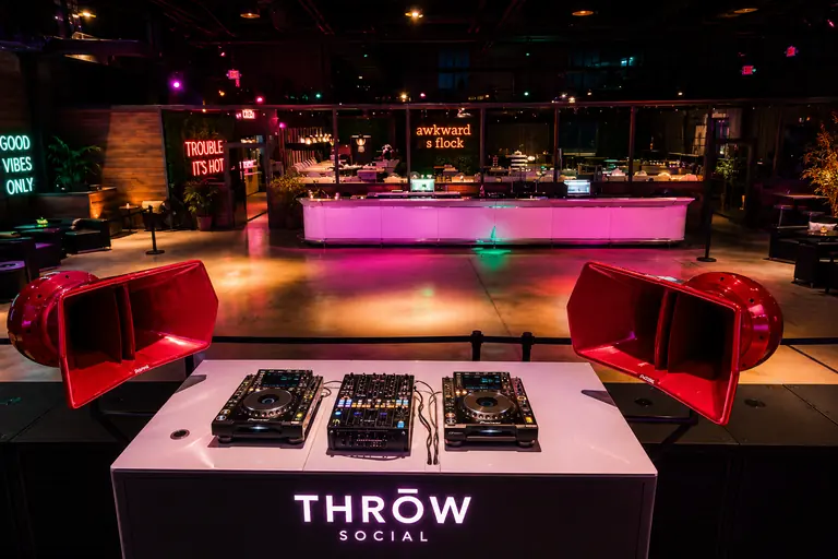 The DJ booth between two red Void Air Vantage horns