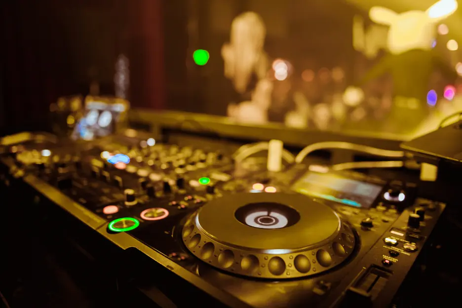 Close-up of a Pioneer player and mixer in blue light